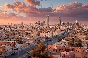 Vibrant skyline of Riyadh at sunset with urban landscape and dra