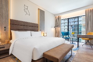 Cozy, tech-equipped room with amenities.